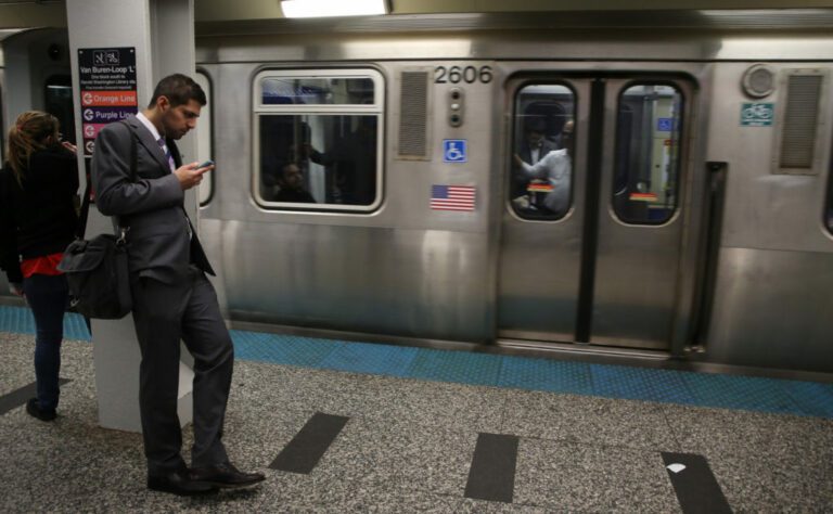Man in suit waiting in the train station